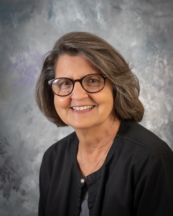 Nancy Lingenfelter, RN is the Diabetes Educator at the Fulton County Medical Center. She is sitting at a table with human anatomy model pieces.